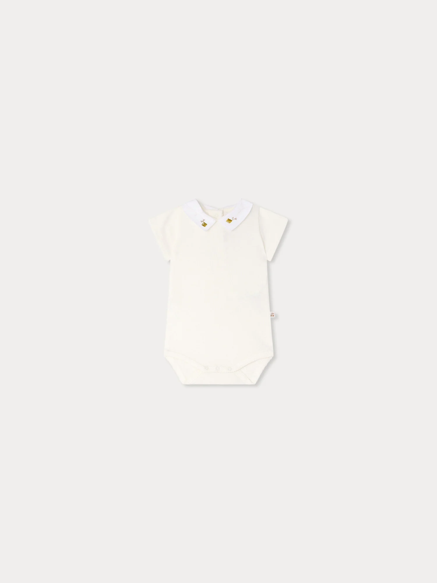 Juillet bodysuit with hand-embroidered kites in organic cotton