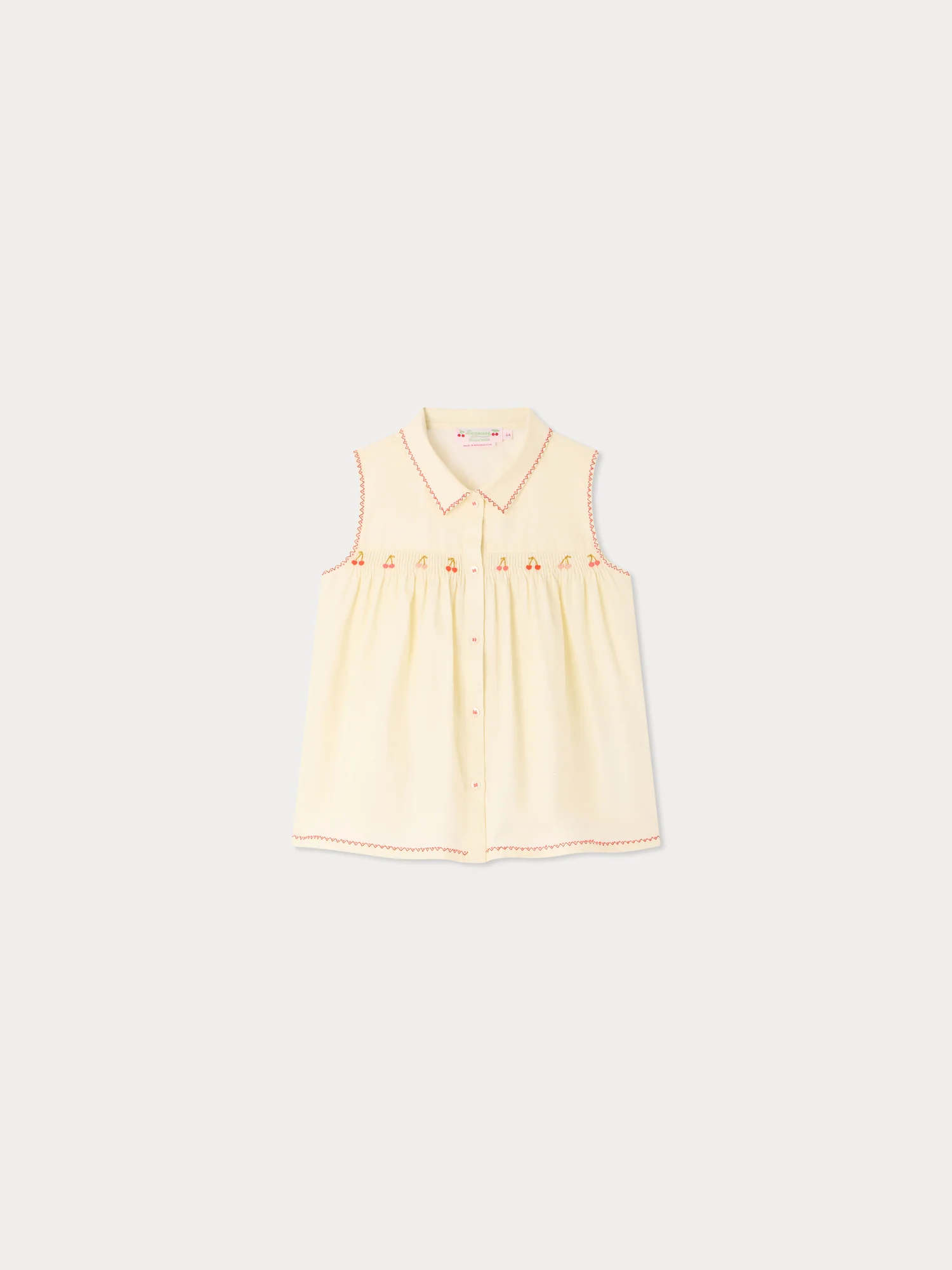 Lexi smocked and hand-embroidered blouse in organic cotton
