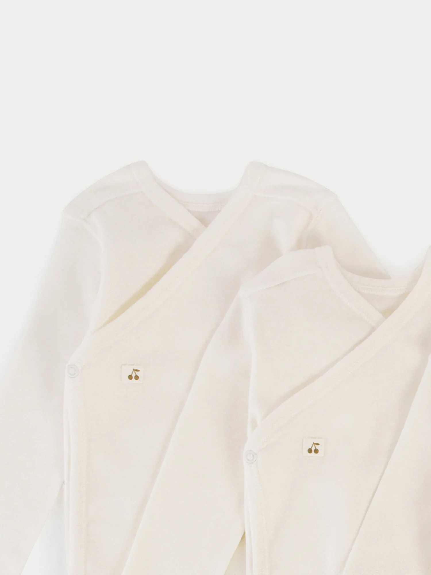 Set of 3 organic cotton wrapover bodysuits in milk-white - Image 2